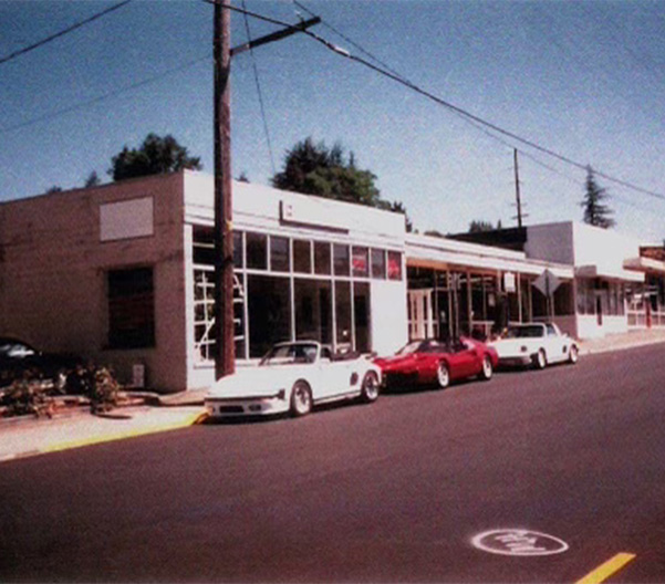 Group of happy friends riding in a car